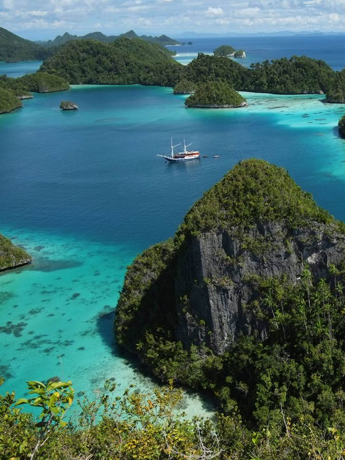 Aerial view of mountainous islands in blue Caribbean.