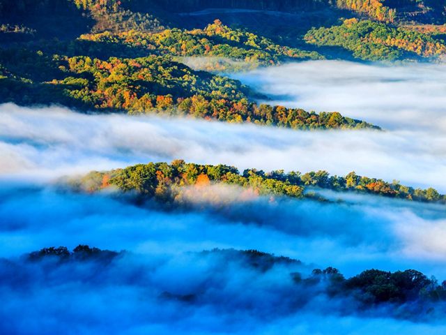 Mist rises above ridges at the Ataya tract.