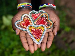 beaded ornaments in a hand