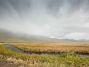 Ruby Lake with fog-covered mountains in the background.