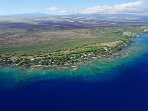 Aerial view of the Puakō, Hawai‘i coastline showing the coral reef that spans the length of the entire coast.