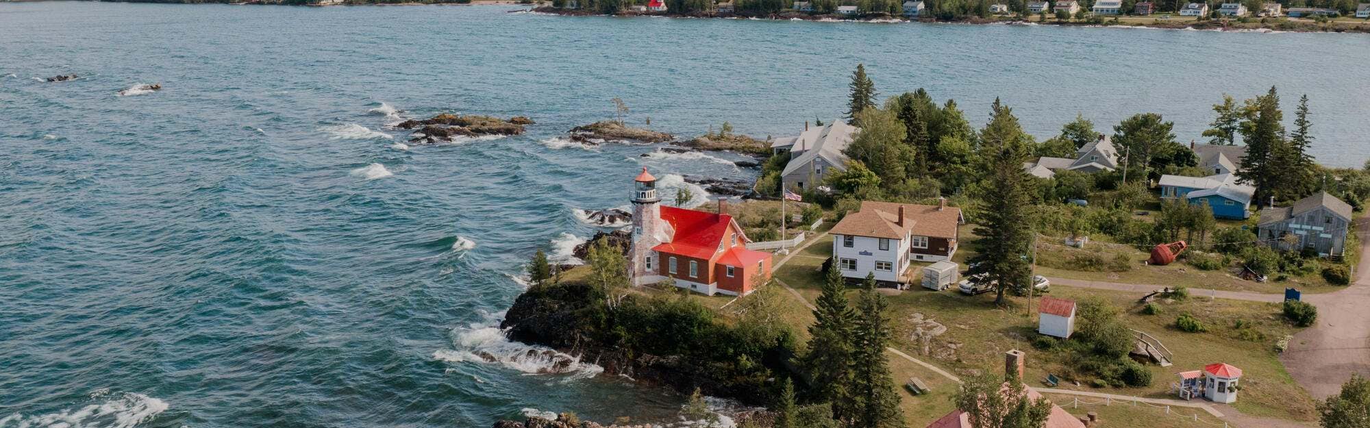 A red lighthouse stands out in Eagle Harbor on the Keweenaw Peninsula.