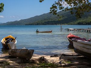 Fishing boats along a coast in Pedro Cays, Jamaica