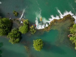 Kayakers Filip Ferderber (in white and blue kayak) and Luka Dzajo (orange and red kayak) and Luka Seketa kayaking down a small waterfall in Mreznica river near Keici in Croatia.

Filming crew with Ciril Jazbec, Ausma Cirulniece, Matic Oblak and the local kayaking guide Kreso Rogoz are in yellow boats next to them.

Kreso Rogoz is “Croatia Open Land tours DMC” business owner who is passionate about sustainable tourism, travel and leisure industries, as well as certified guide to cultural heritage in the EU.

Luka Seketa is a local kayaker working in “Croatia Open Land tours DMC” as a kayaking guide for tours on the river.